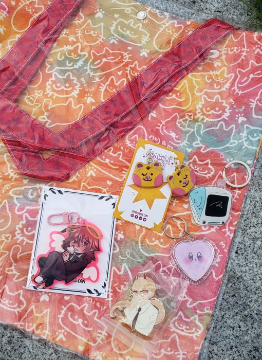 a totebag, some keychains, charms, and earrings