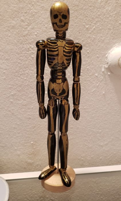 one of those wooden anatomy things but it's a skeleton